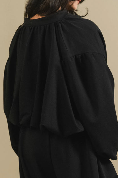 Black blouse with gathered yoke and voluminous puff sleeves
