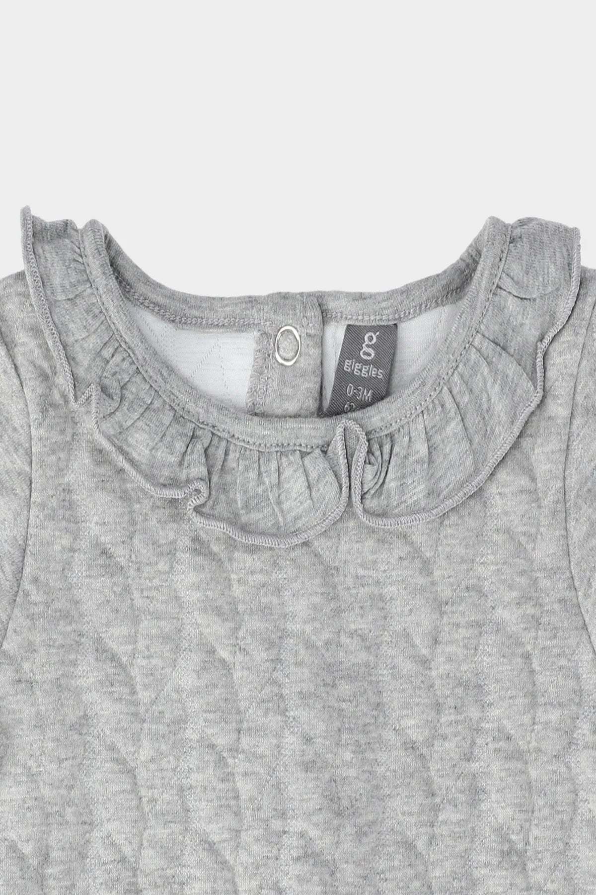 Grey baby dress close-up: round neck, small button placket, knit texture