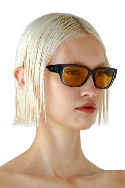 Dark frame amber lens sunglasses on a model, straight silhouette