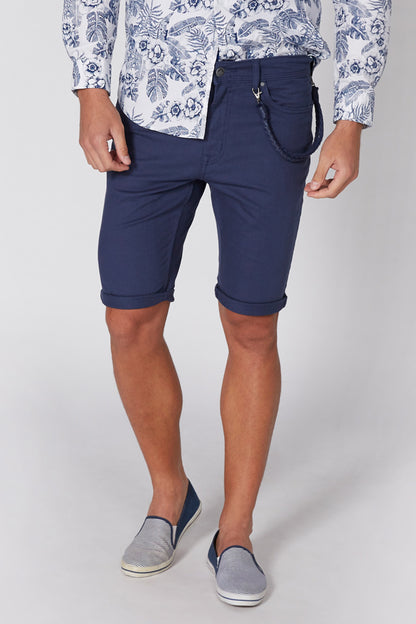 Navy blue shorts, knee length, with side slant pockets and patch coin pocket