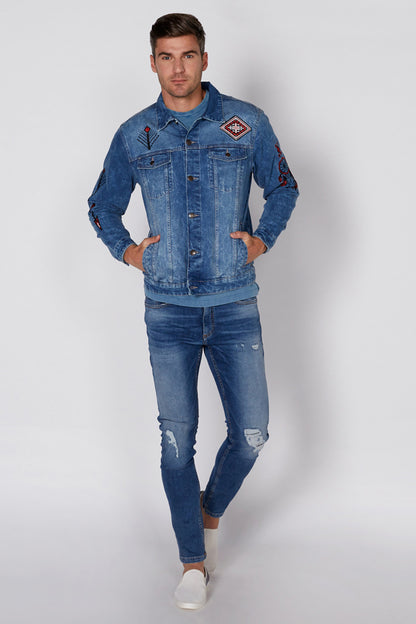 Blue denim jacket and ripped jeans outfit with front buttons and embroidered patches