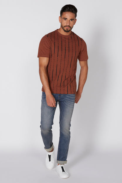 Medium blue denim jeans with five pockets and rolled cuffs, full-body view