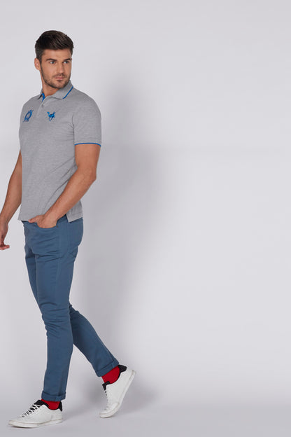 Blue jogger pants on model, slim fit with drawstring waist
