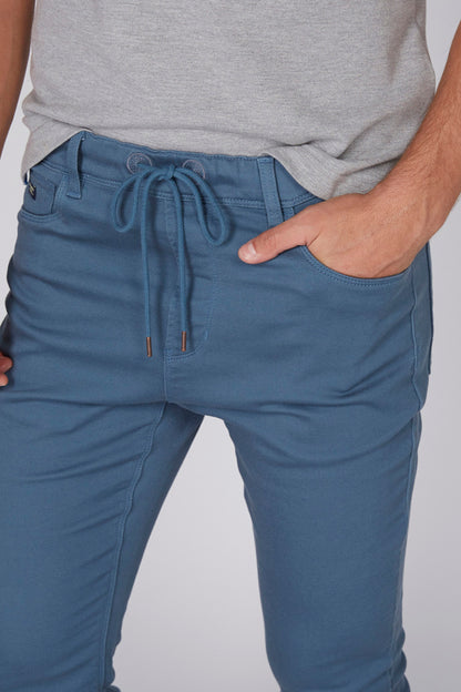 Blue drawstring jogger pants with elastic waistband and side pockets