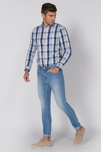 Light blue denim jeans with belt loops and rolled cuffs, worn with casual shoes