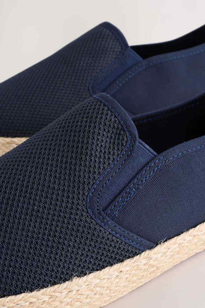 NEXT navy slip-on espadrilles close-up, elastic gore and woven fabric texture