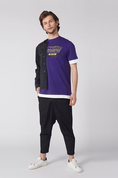 Black denim jacket with button front, worn open over a purple T-shirt.