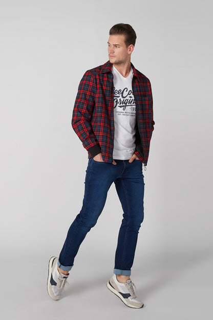 Blue denim jeans with zipper fly, five-pocket styling, and tapered legs