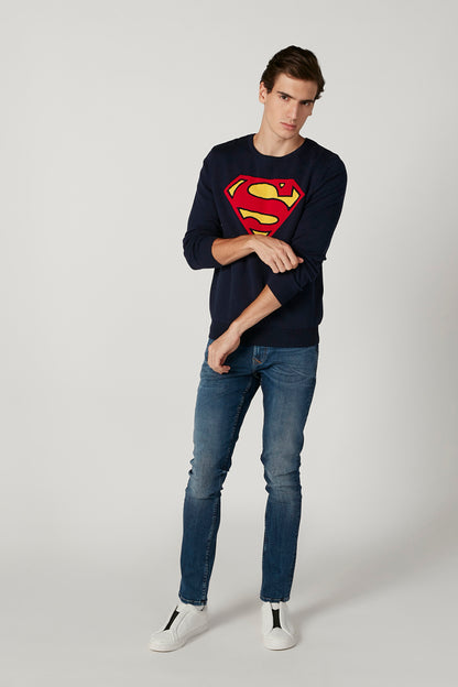 Blue straight-fit denim jeans with distressed patches and cuffed hems