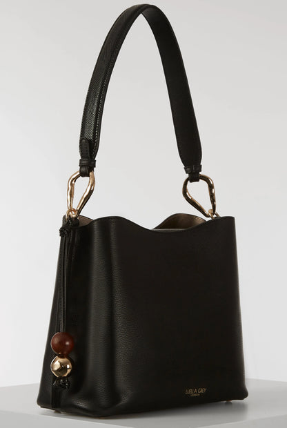 Black leather-look shoulder bag with gold hardware and side bead charm