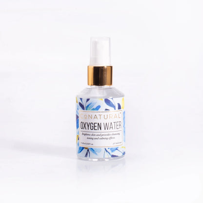 Conatural oxygen water bottle with white pump, gold collar and blue label