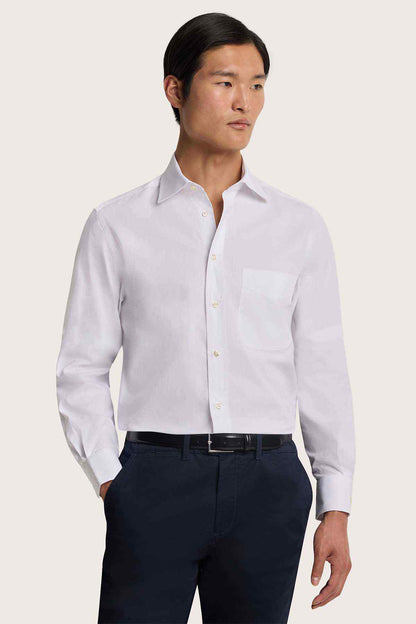 White button-up dress shirt with chest pocket and long sleeves