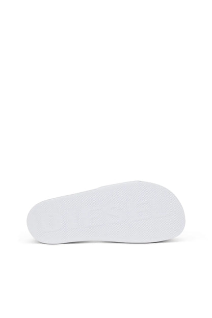 White slide sandals, oval footbed side view