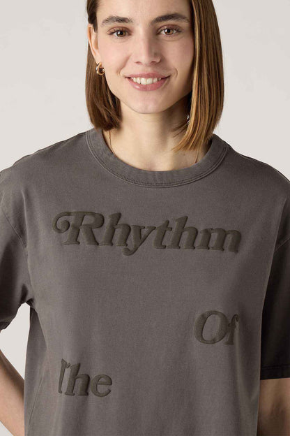 Women's dark gray T-shirt close-up with 'Rhythm' and 'Or' text