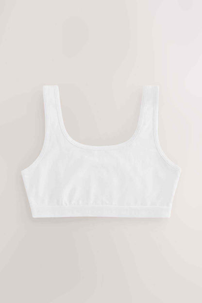 White crop bra with wide straps and rounded neckline, soft stretch fabric