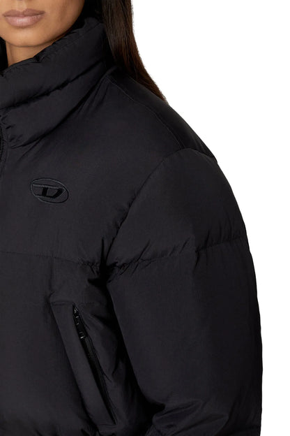 Black puffer jacket shoulder with chest logo and zip pocket detail.