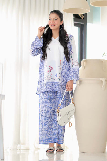 Womenâ€™s blue floral printed kurta set with white inner top and matching pants