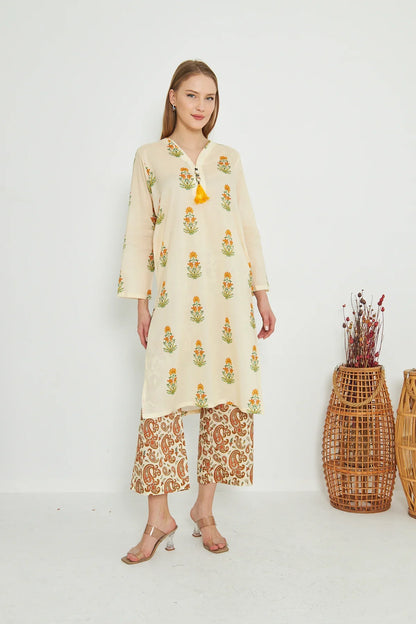 Cream printed long kurta with long sleeves and matching orange patterned palazzo pants