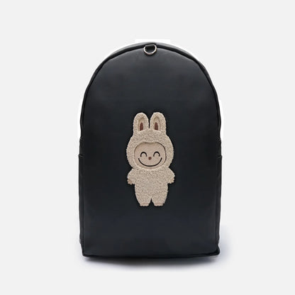 Black backpack with rounded top handle and bunny character patch on front