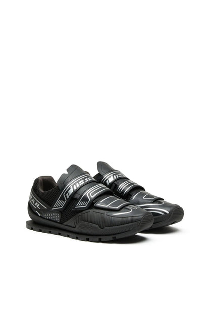 Black trail sneakers with two Velcro straps and graphic logo on side
