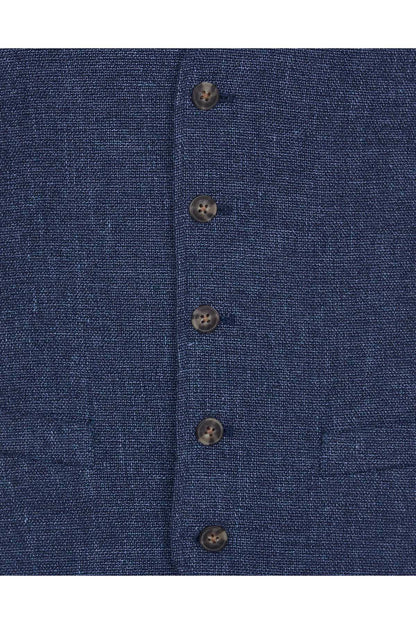 Men's blue textured waistcoat button placket close-up with round dark buttons