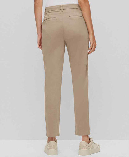 Fitted tan chinos, back view with belt loops and tapered straight legs