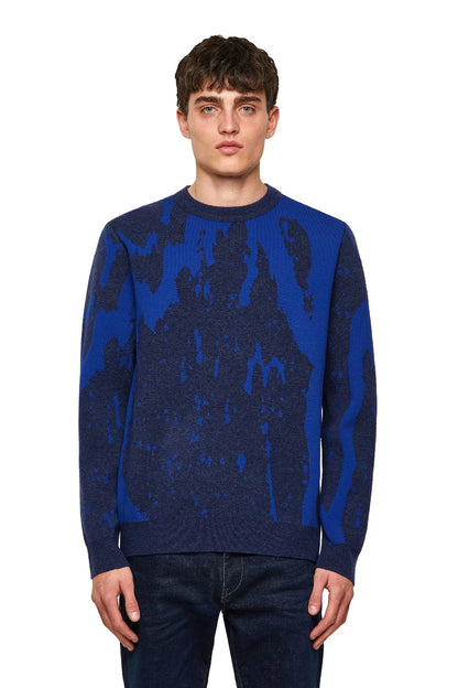 Blue Diesel crewneck sweater with long sleeves, dark abstract pattern.