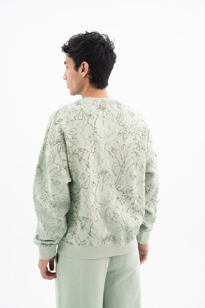 Cameo green printed crewneck sweatshirt with ribbed hem, paired with matching pants