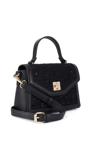 Black mini handbag with top handle and crossbody strap with gold hardware