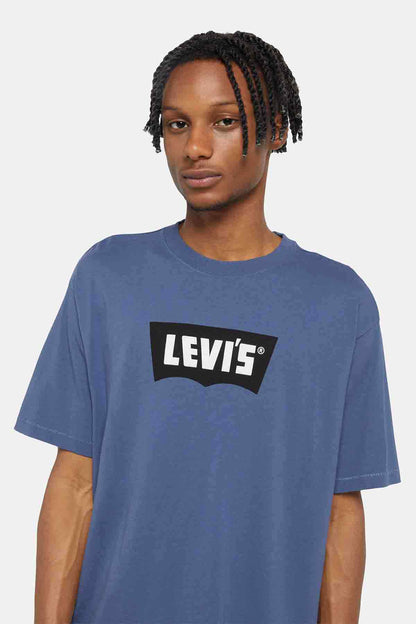 Blue crew-neck T-shirt with black logo patch, short sleeves