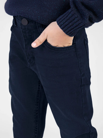 Dark blue denim jeans with button closure and front coin pocket