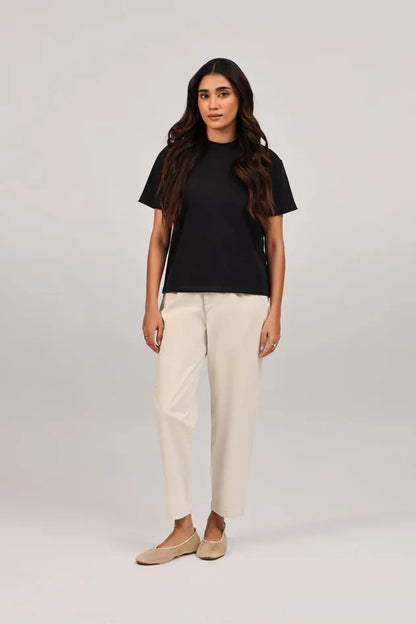 Ecru cropped trousers with front button and slanted side pockets
