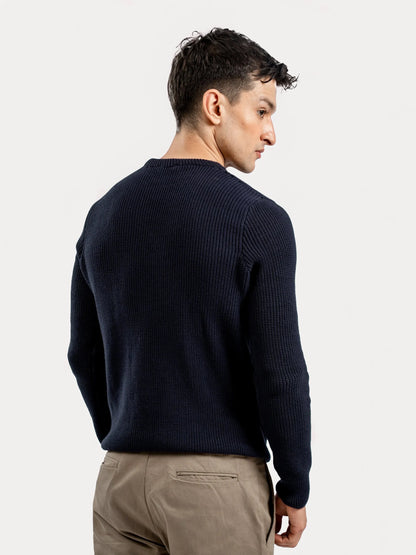 Navy blue cotton knit sweater with crewneck and long sleeves, back view