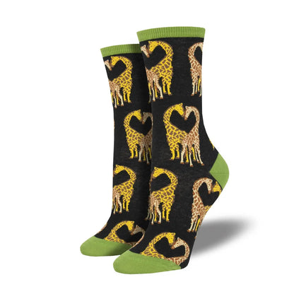 Black crew socks with repeating yellow giraffe print and olive green heel and toe