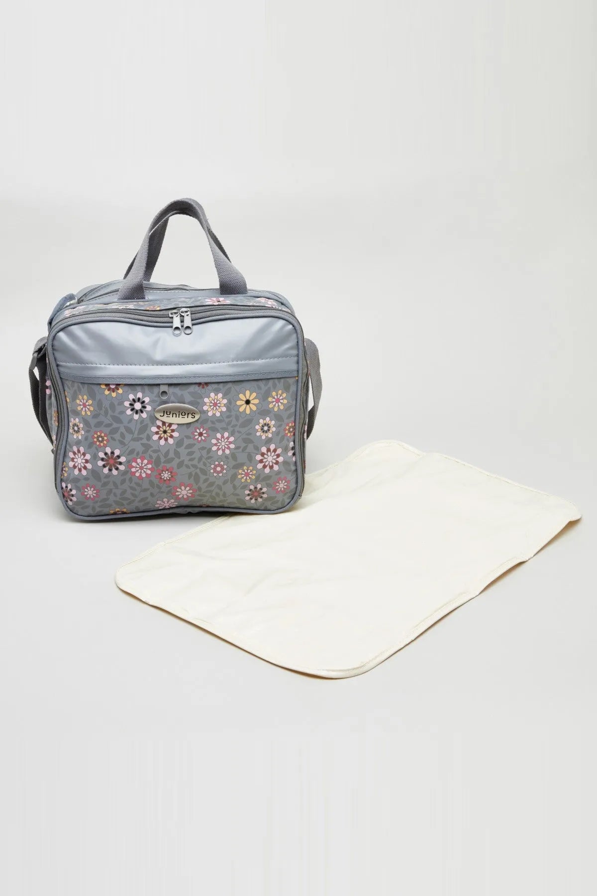 Grey floral diaper bag with zip front, handles, and included changing mat