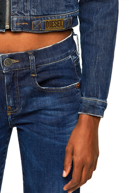 Blue denim jacket sleeve and hem detail with buttoned cuff and stitching