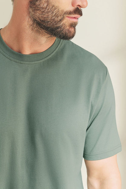 Green short-sleeve crewneck T-shirt, smooth fabric and stitched neckline.