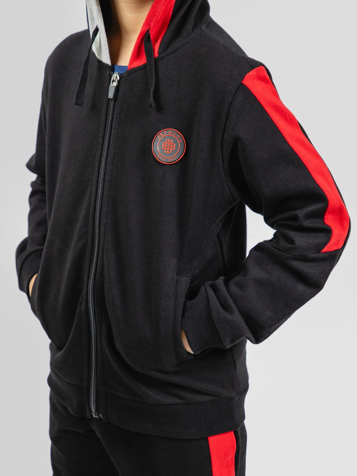 Black 100% cotton zip hoodie with front zipper, red accents, and round logo patch