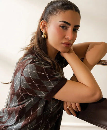 Fitted argyle knit top, dark with white diamond pattern, short sleeves and ribbed collar