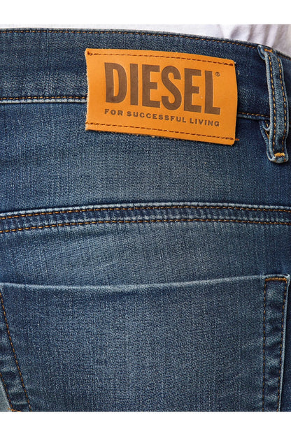 Diesel patch label on blue denim jeans waistband with visible stitching details