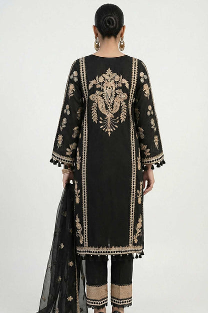 Back view: black embroidered kurta with gold vertical panel and tasselled hem