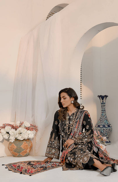Black embroidered kurta dress with long paisley dupatta, seated pose with fabric drape