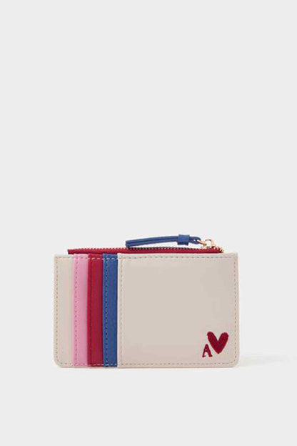 Beige mini clutch with pink, red, and blue panels, zip top and heart detail