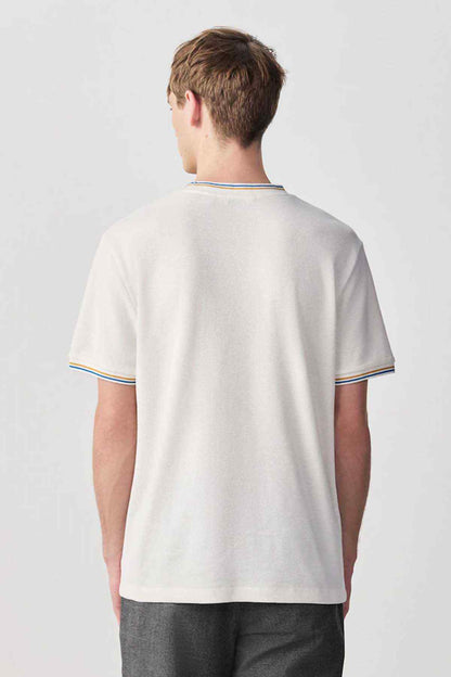 Ecru short-sleeve T-shirt, back view, contrast ribbed collar with striped edge