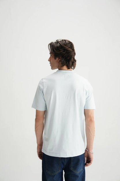 Light blue crew-neck short-sleeve T-shirt on model, back side view