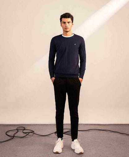 Navy fitted crewneck sweater with white rib trim and small chest logo, long sleeves