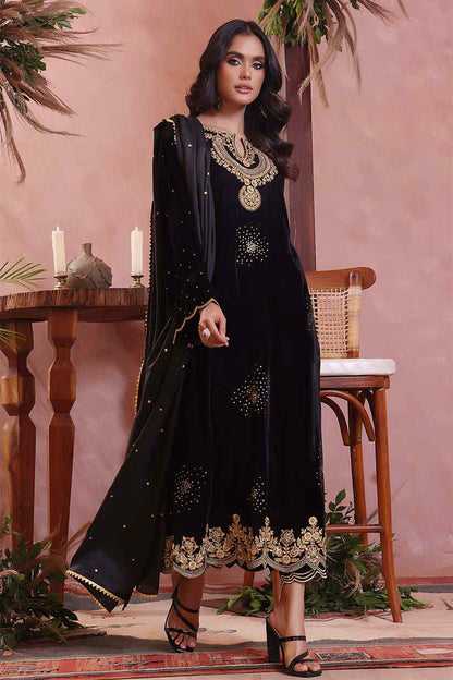 Black embellished long dress with gold border, matching neckline necklace detail