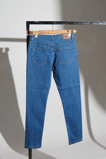Blue denim jeans with straight leg fit, belt loops, and stitched back pockets