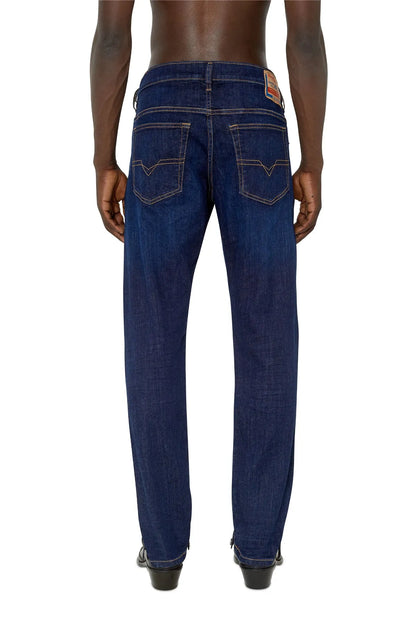 Blue denim jeans, back view with yoke stitching, rear pockets and straight leg