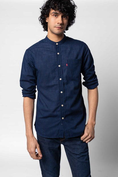 Men's blue striped button-up shirt with small chest logo